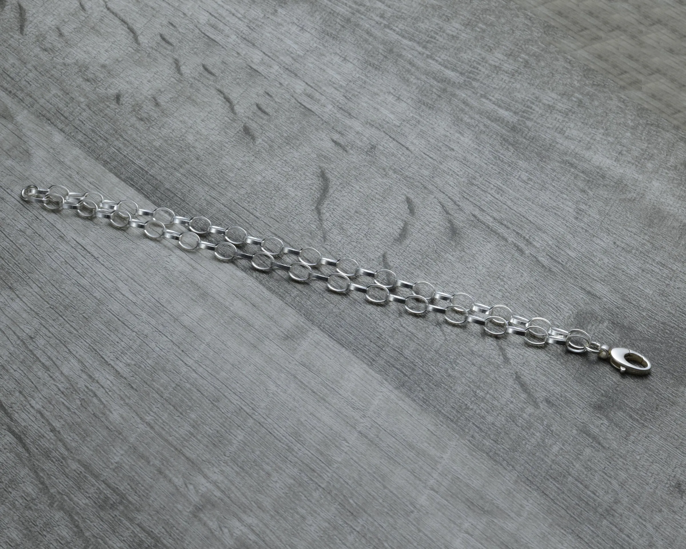 LAYERED STERLING SILVER CHARM BRACELET