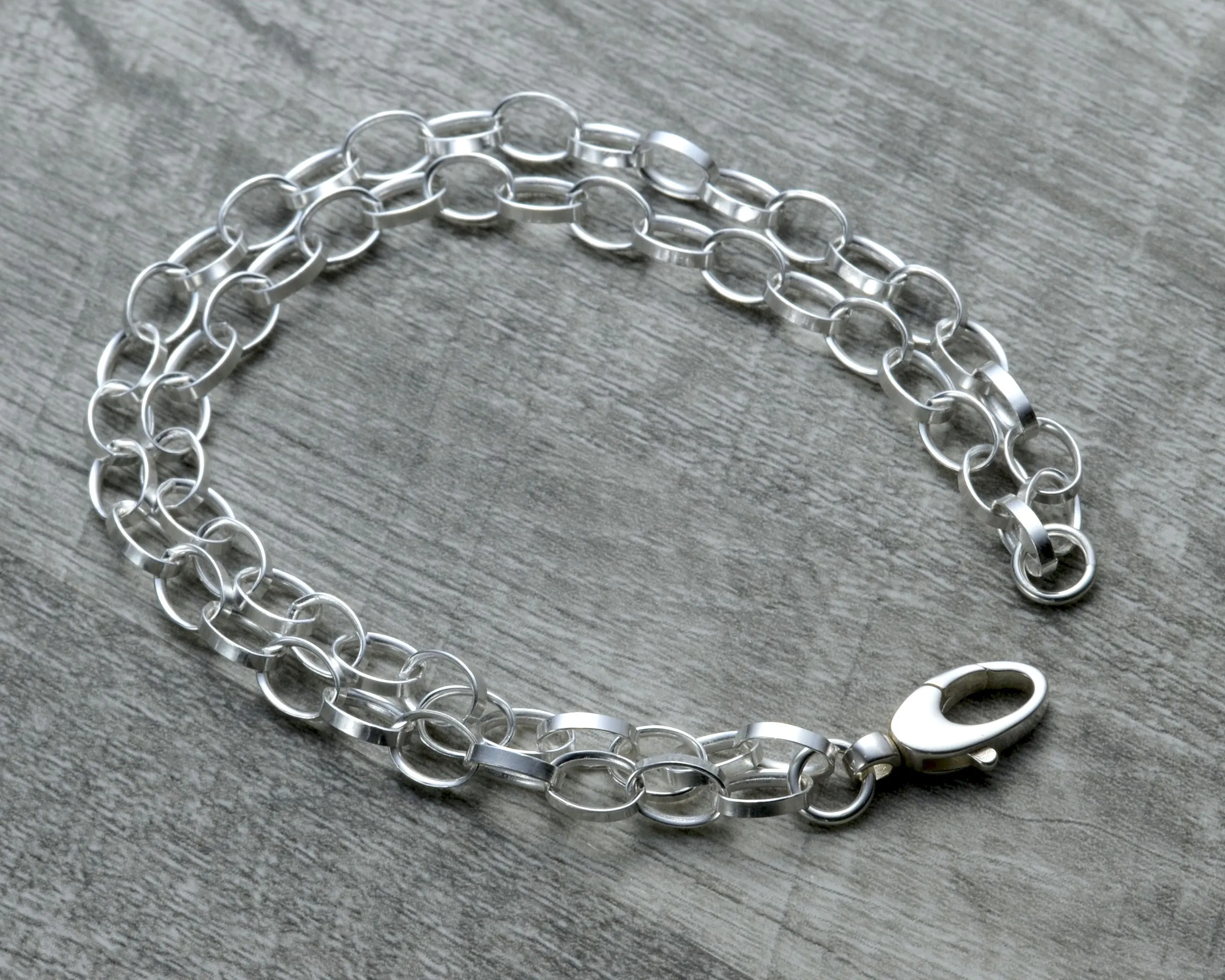 LAYERED STERLING SILVER CHARM BRACELET