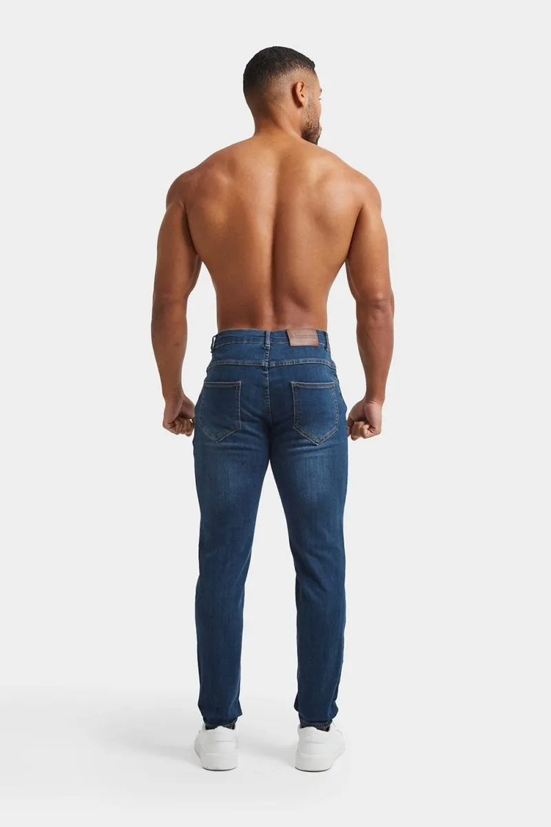 Muscle Fit Jeans in Dark Blue