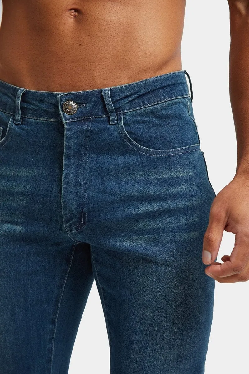 Muscle Fit Jeans in Mid Blue